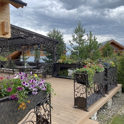 Patio railings with flower pots, decorating acottage in the High Tatras