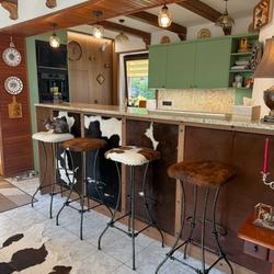 Hand-forged bar stools with cowhide leather seats Hand-forged bar stools with cowhide leather seats