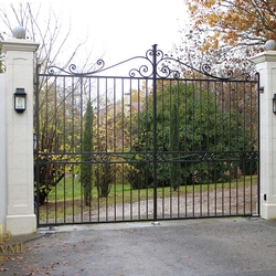 A wrought iron gate with underground drives openers - A luxury gate in France
