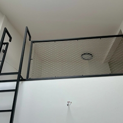 The use of space in high rooms will be ensured by a modern metal railing with a ladder